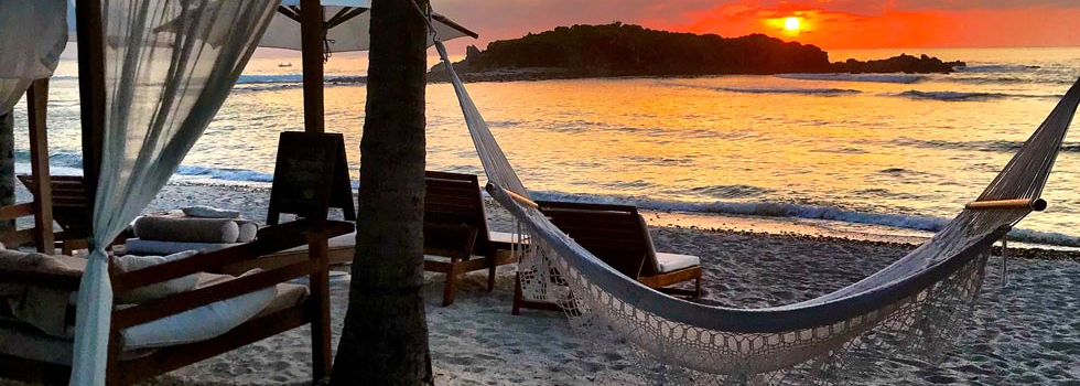 hammock along beachfront in punta de mita mexico